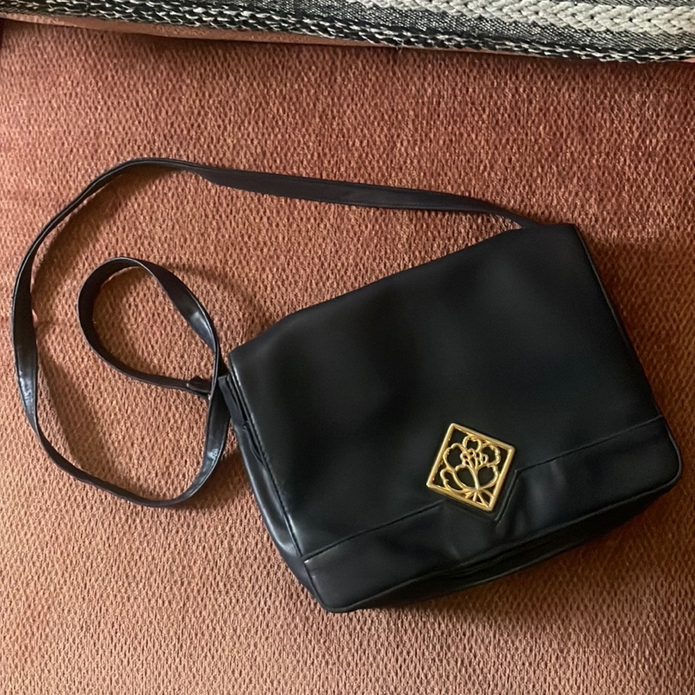 Vintage navy blue crossbody satchel bag with floral pendant detail